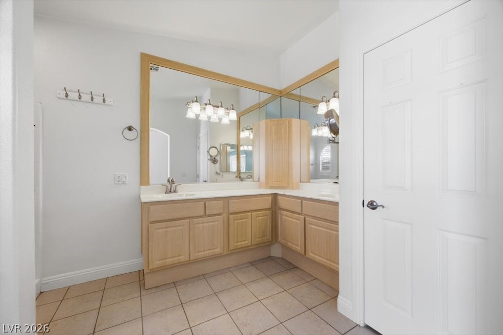 573 Beryl Court Henderson, NV 89015 - Photo 32 of 52 Primary bathroom features two vanities with lots of cabinets and storage