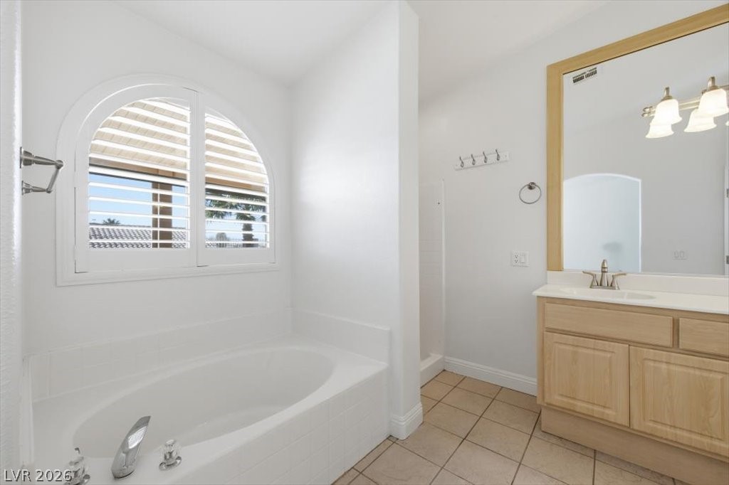 573 Beryl Court Henderson, NV 89015 - Photo 33 of 52 Luxurious primary bath features a garden tub and separate walk-in shower.