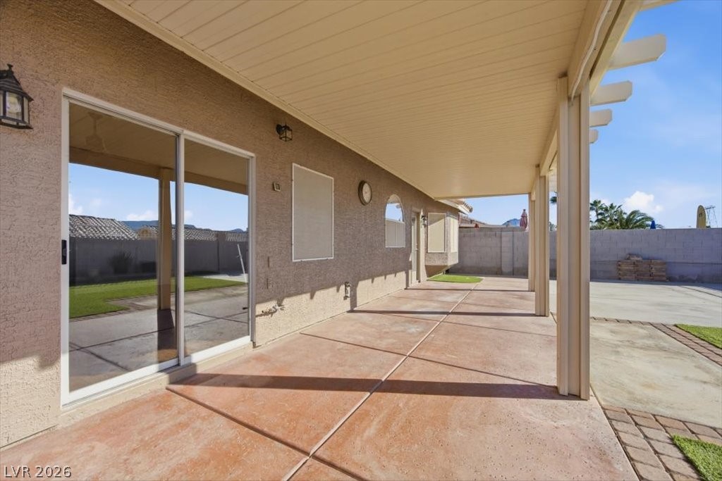 573 Beryl Court Henderson, NV 89015 - Photo 37 of 52 Backyard has a full length covered patio for entertaining and relaxing while taking in the sunsets.