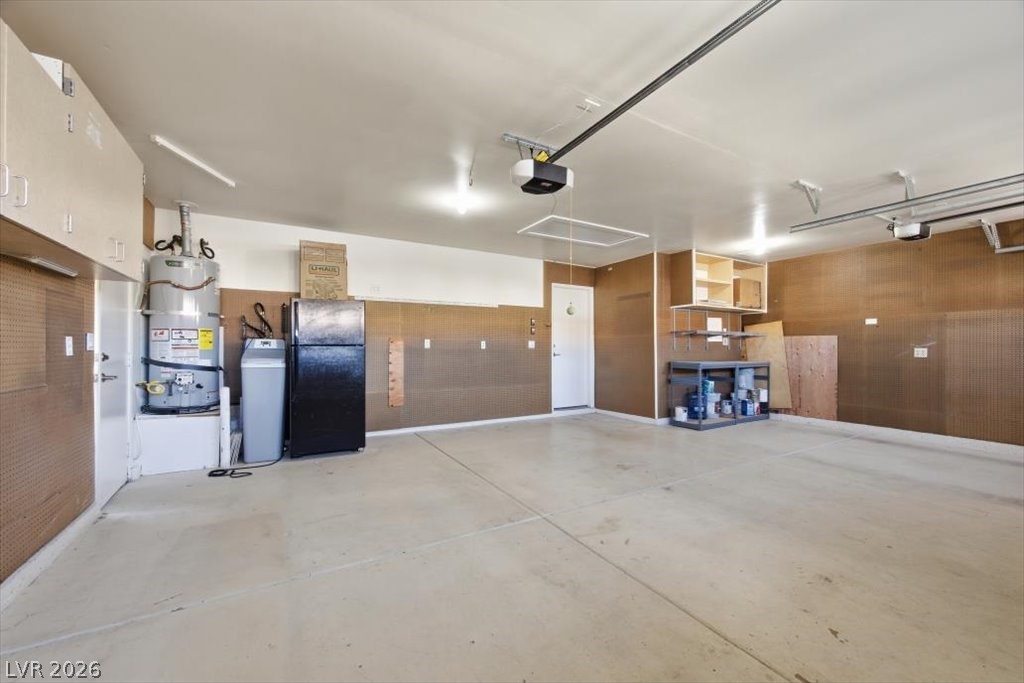 573 Beryl Court Henderson, NV 89015 - Photo 50 of 52 Fully finished 3 car garage with attic access, two garage door openers, and lots of peg board for all the tools! The garage refrigerator is included.