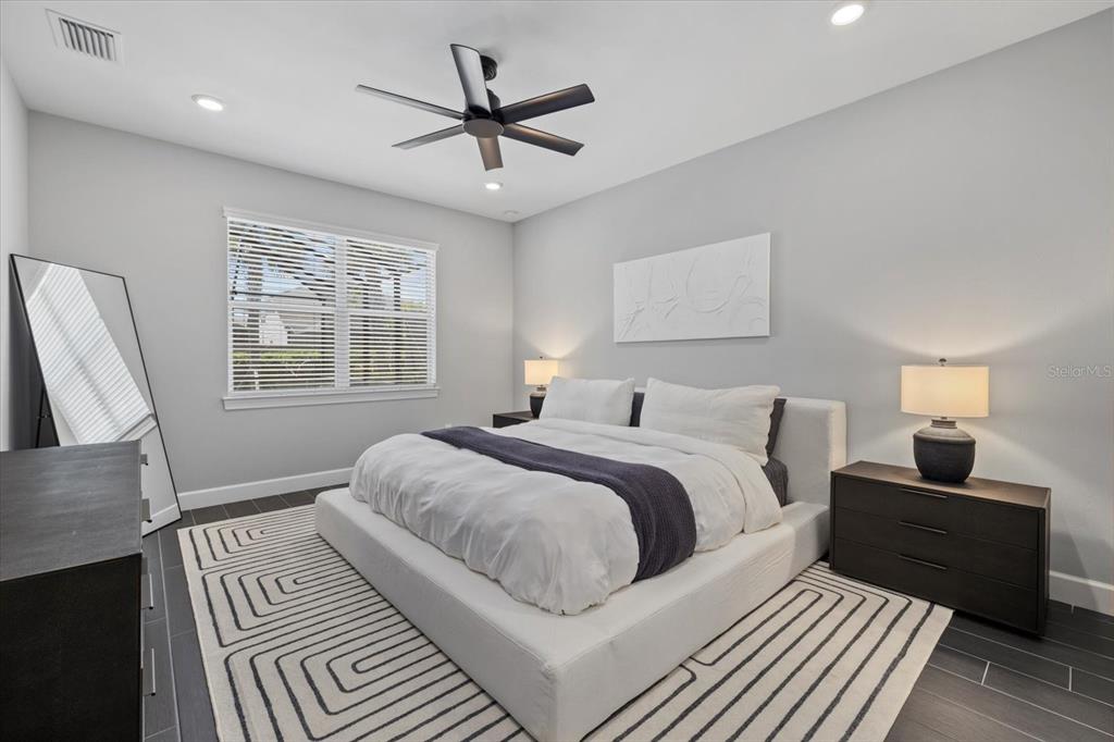 3508 Anchor Bay Trail Lakewood Ranch, FL 34211 - Photo 19 of 74 a bedroom with a large bed and a window