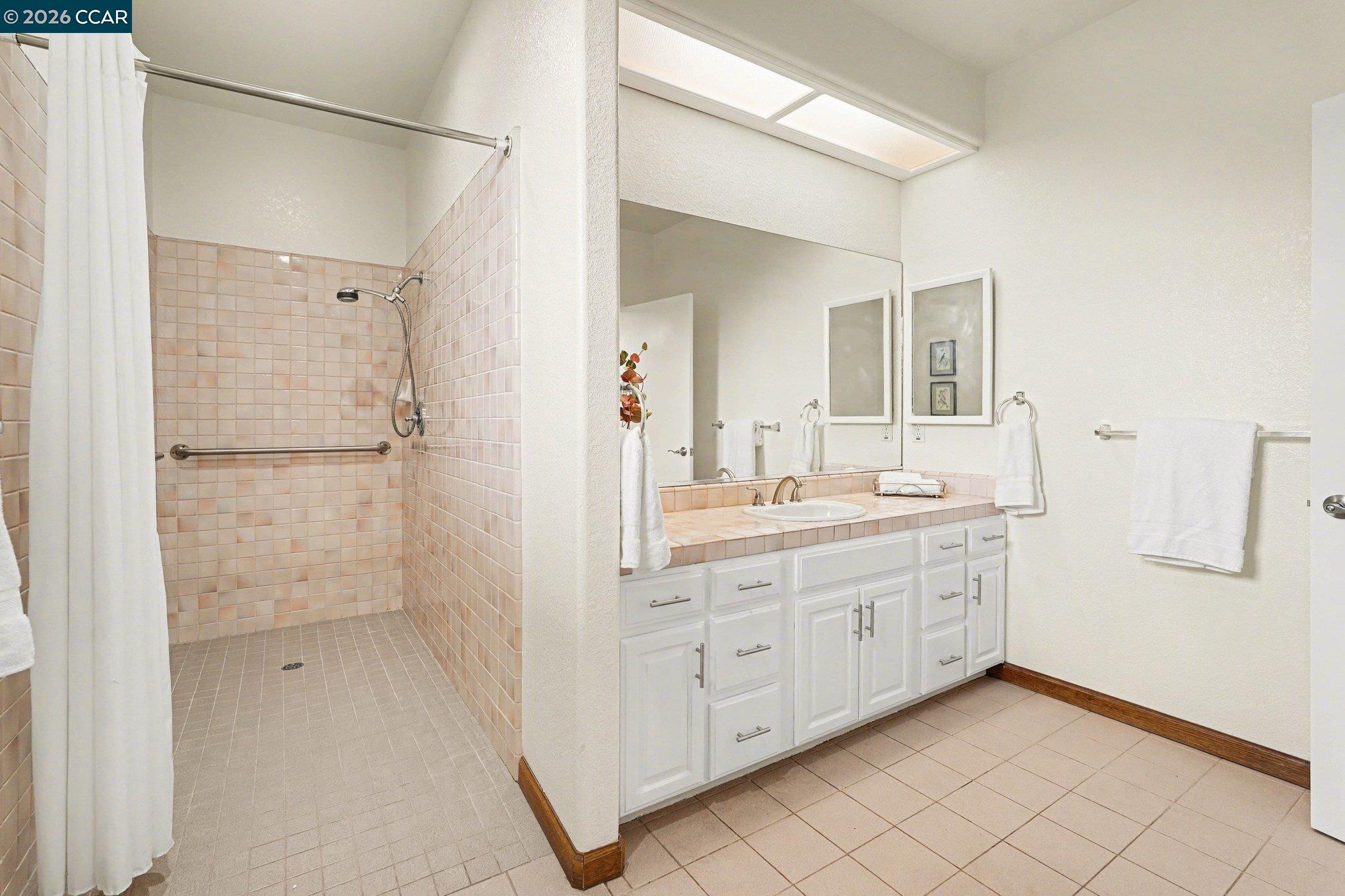 4885 Milden Road Martinez, CA 94553 - Photo 25 of 52 a bathroom with a granite countertop sink mirror and double
