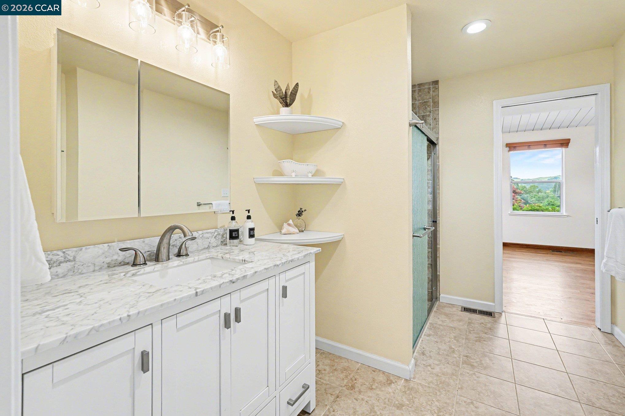 4885 Milden Road Martinez, CA 94553 - Photo 27 of 52 a bathroom with a sink and a mirror