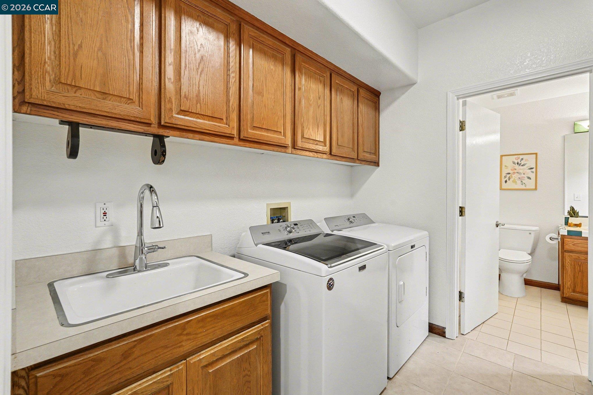 4885 Milden Road Martinez, CA 94553 - Photo 30 of 52 a utility room with sink dryer and washer