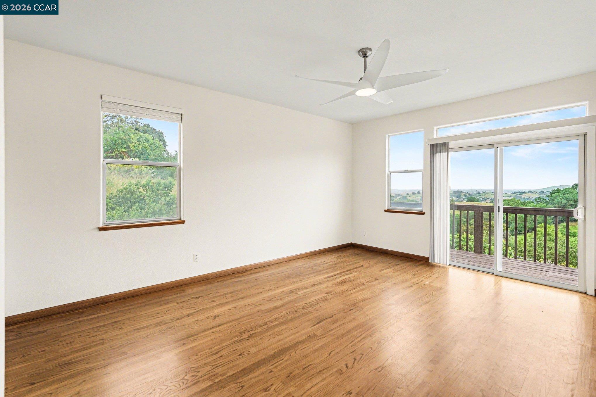 4885 Milden Road Martinez, CA 94553 - Photo 39 of 52 an empty room with wooden floor and windows
