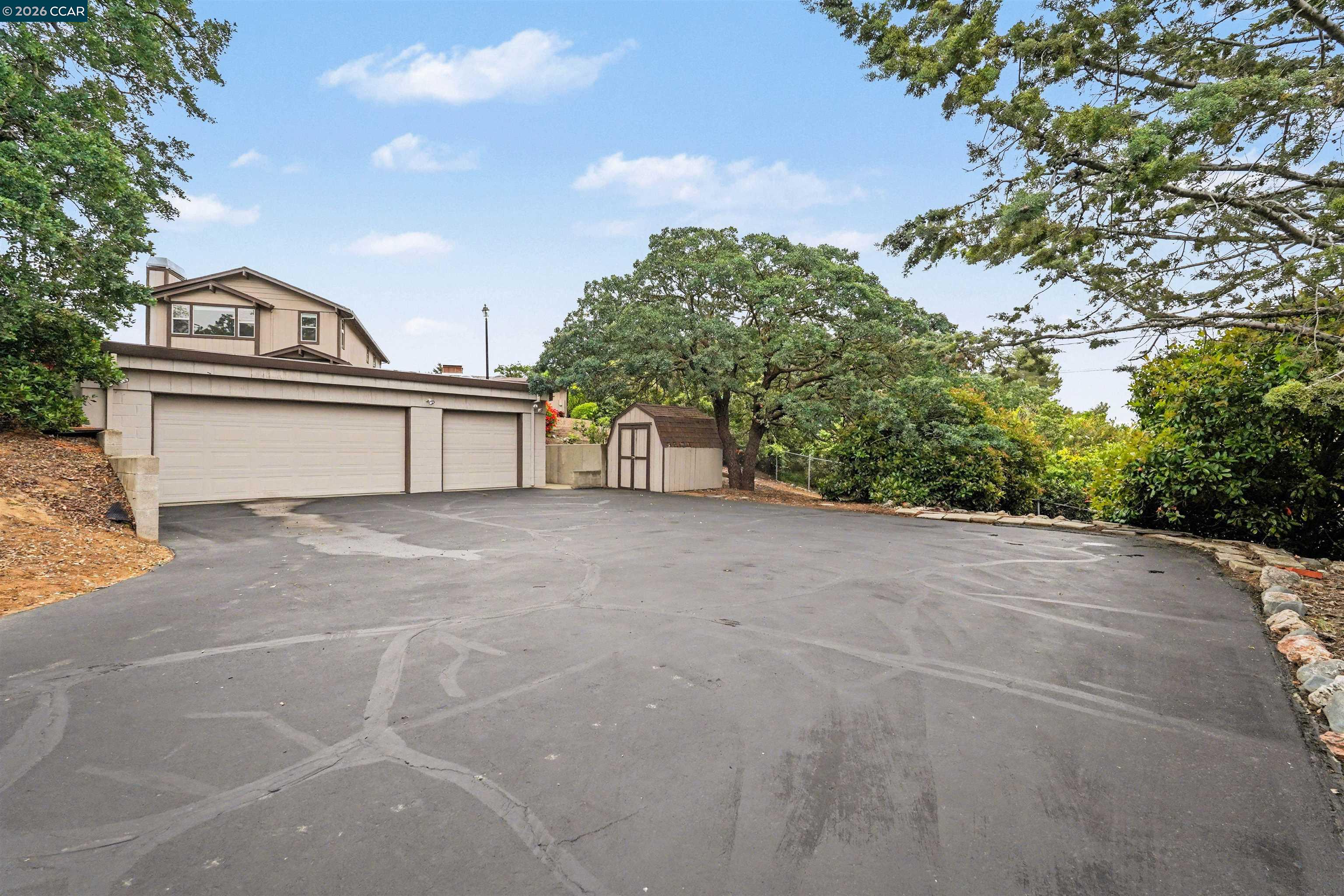 4885 Milden Road Martinez, CA 94553 - Photo 7 of 52 a view of a house with a yard and a large tree