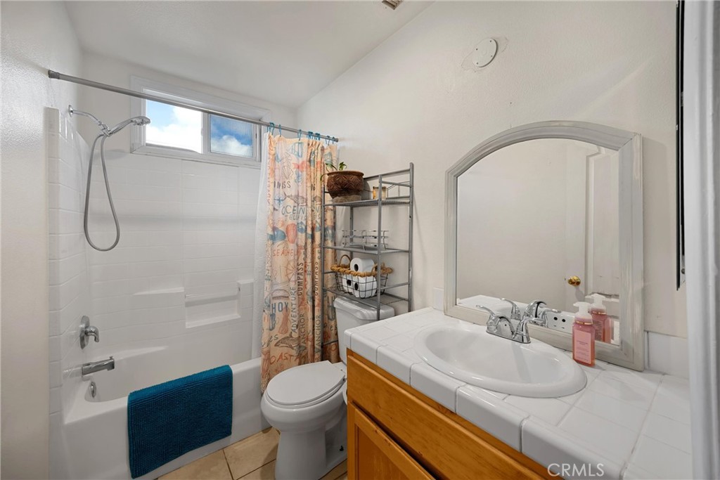 14508 Cabazon Street Cabazon, CA 92230 - Photo 11 of 22 a bathroom with a sink toilet and shower