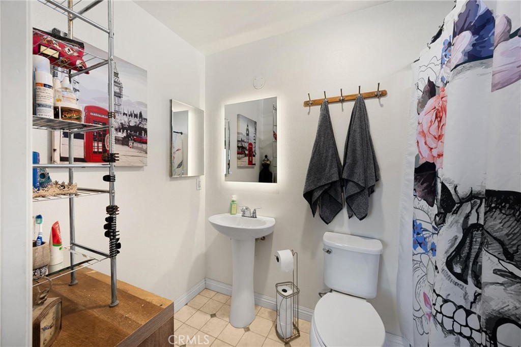 14508 Cabazon Street Cabazon, CA 92230 - Photo 16 of 22 a bathroom with a sink toilet and shower