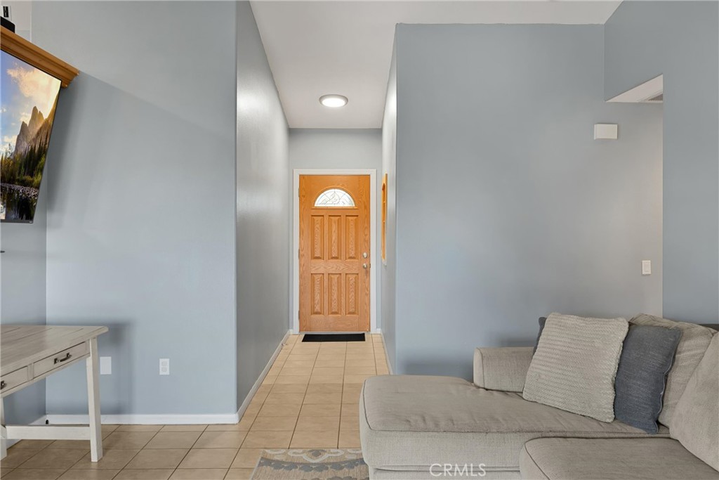 14508 Cabazon Street Cabazon, CA 92230 - Photo 3 of 22 a bedroom with a bed and a television