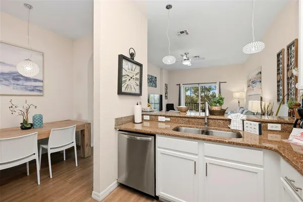 a kitchen with a sink and cabinets