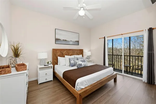 a bedroom with a large bed and a window
