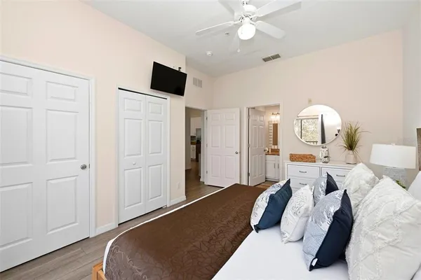 a bedroom with bed and window