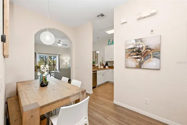 a kitchen with a table and chairs