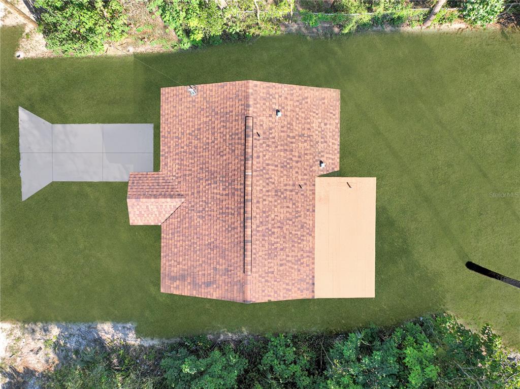 19920 Southwest 108th Place Ocala, FL 34476 - Photo 16 of 17 an aerial view of a house with a yard and lake view