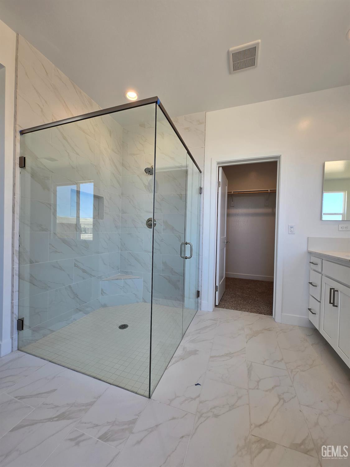 Undisclosed Address Bakersfield, CA 93306 - Photo 13 of 21 a bathroom with a shower and a glass door