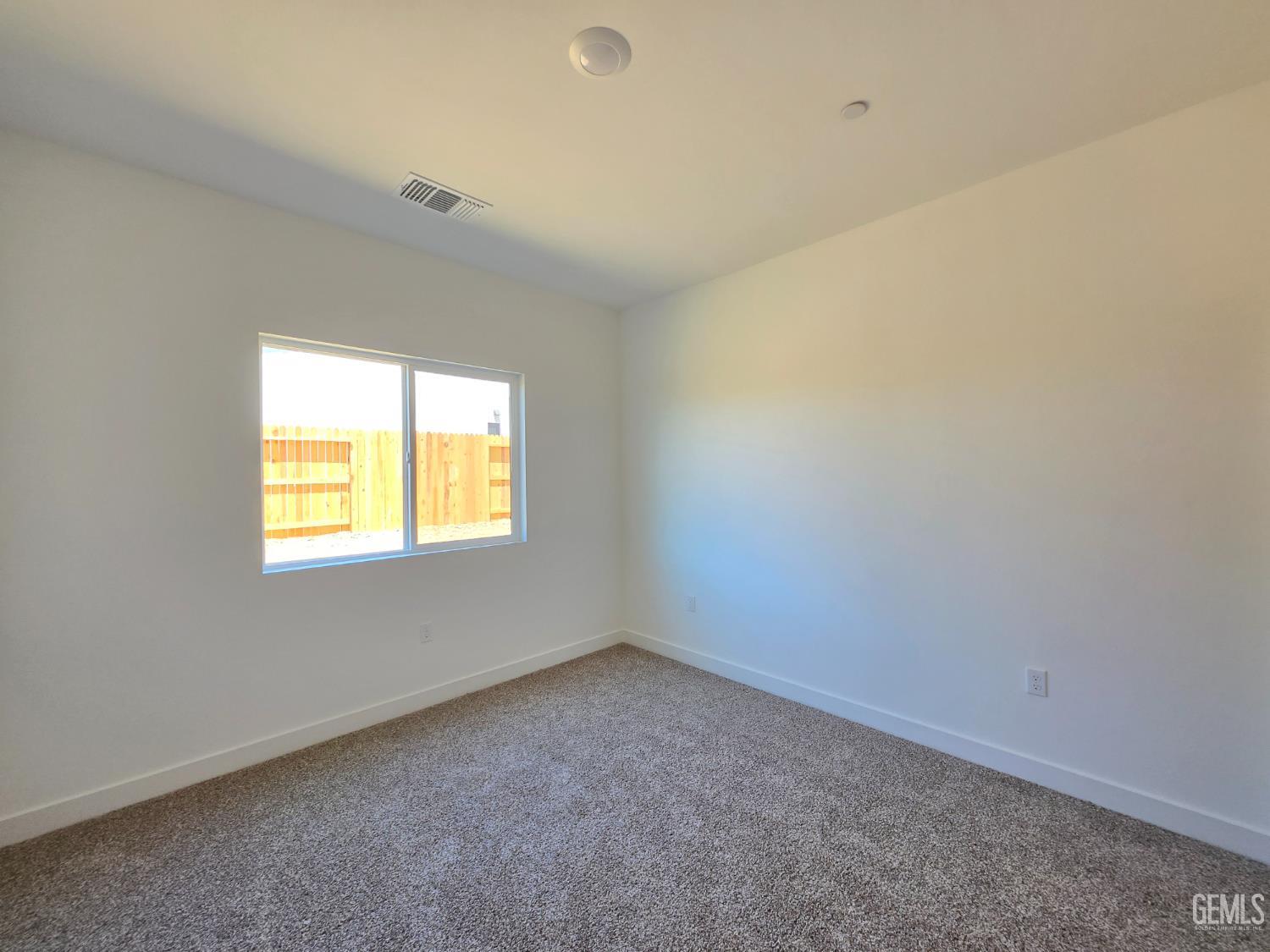 Undisclosed Address Bakersfield, CA 93306 - Photo 17 of 21 an empty room with a window