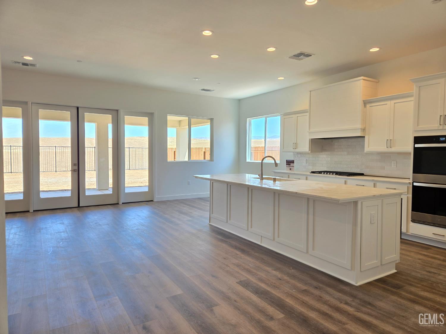 Undisclosed Address Bakersfield, CA 93306 - Photo 3 of 21 a large kitchen with stainless steel appliances granite countertop a large window a sink and a granite counter tops