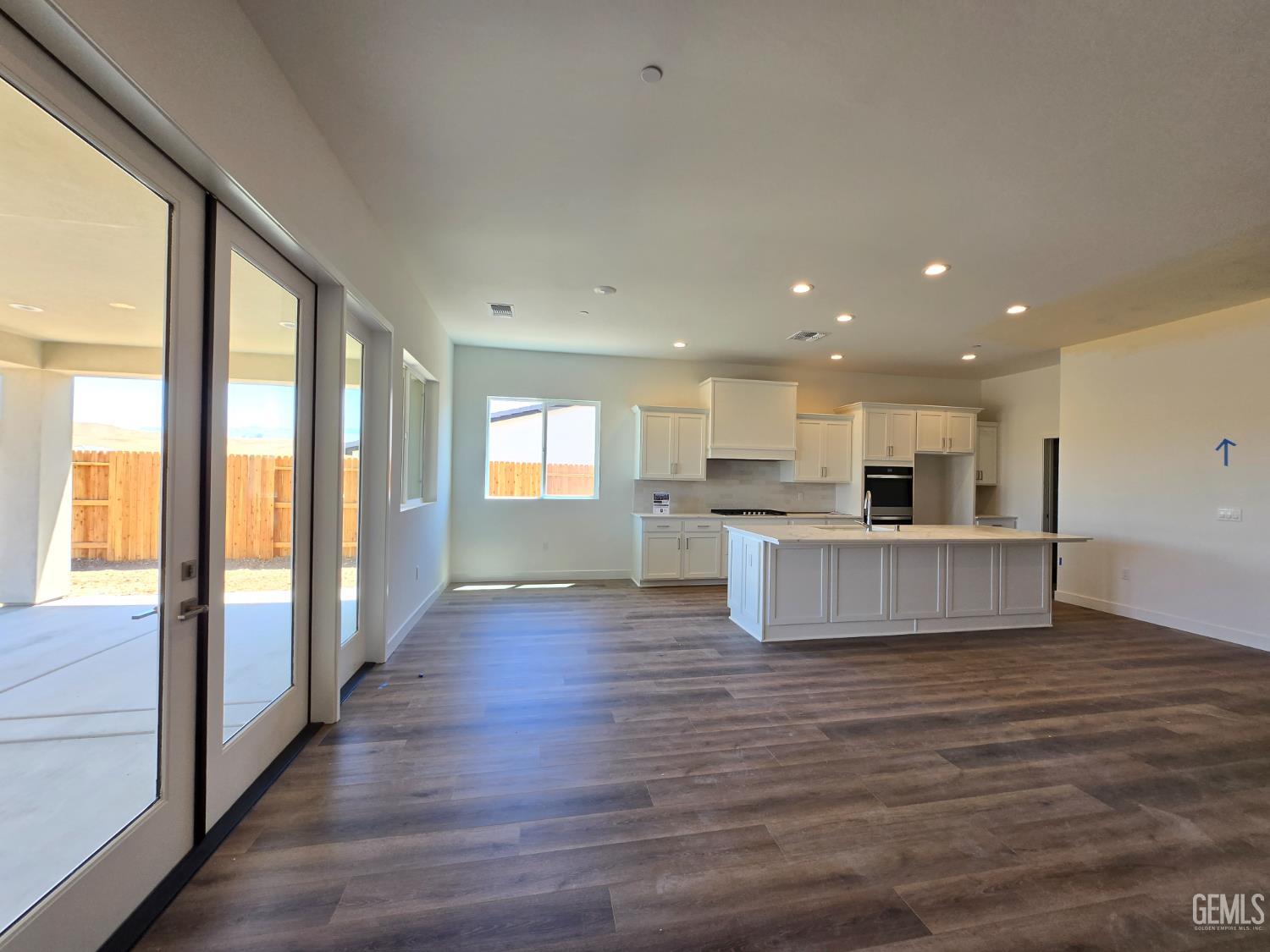 Undisclosed Address Bakersfield, CA 93306 - Photo 7 of 21 a view of kitchen with kitchen island wooden floor and center island