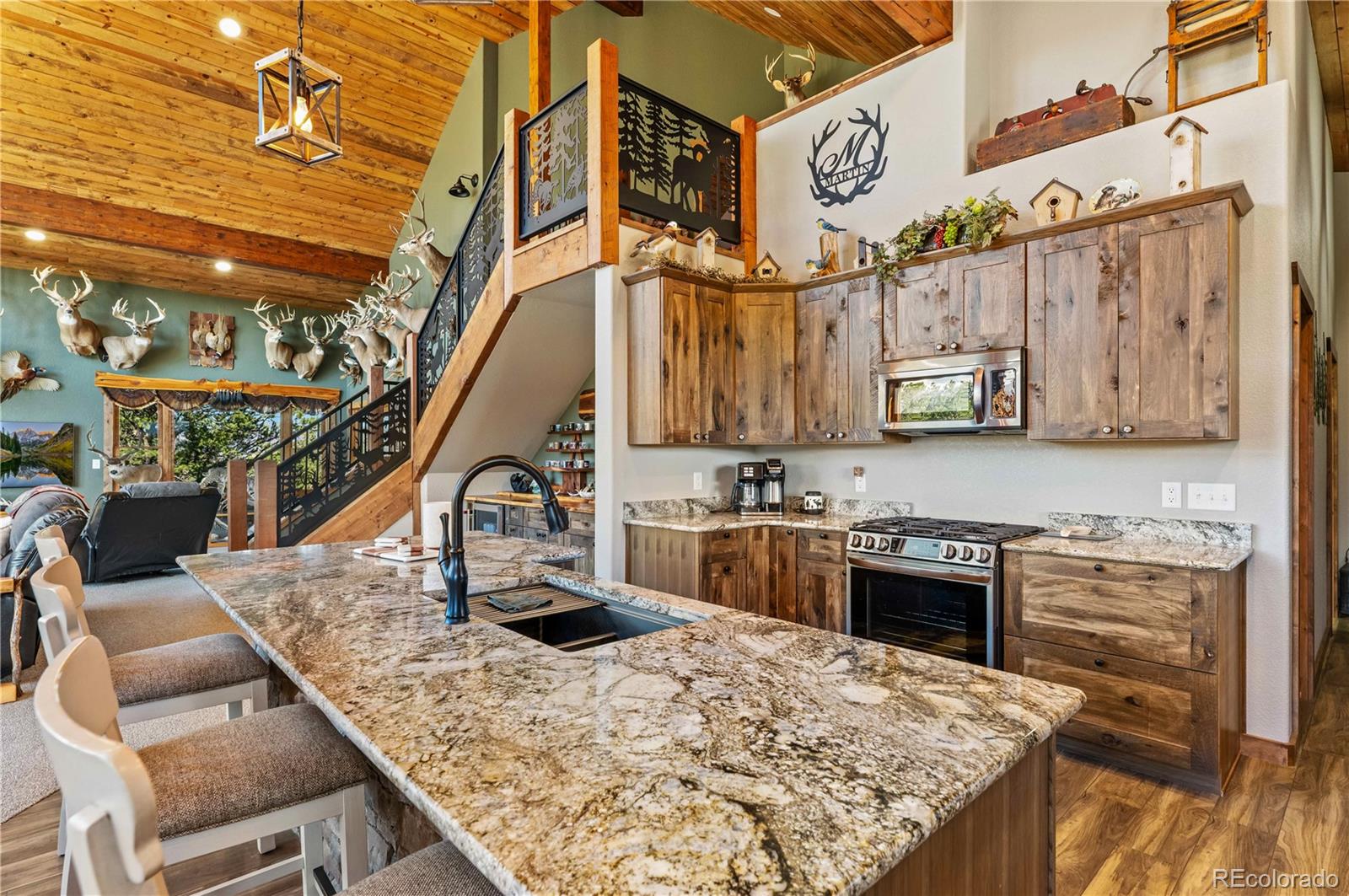 1310 Sunrise Ridge Cotopaxi, CO 81223 - Photo 32 of 50 a view of a kitchen with stainless steel appliances granite countertop a stove and a cabinets