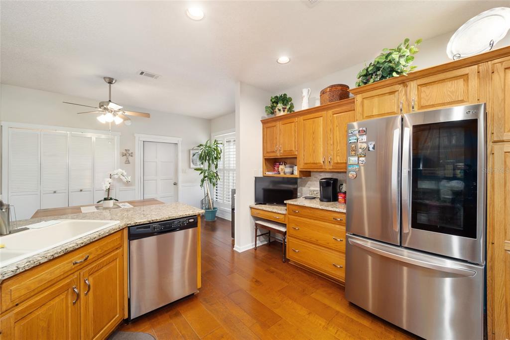 1731 Southeast Clatter Bridge Road Ocala, FL 34471 - Photo 12 of 52 a kitchen with stainless steel appliances a sink and a refrigerator