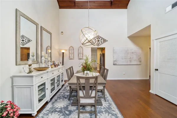 a view of a dining room with furniture window and wooden floor