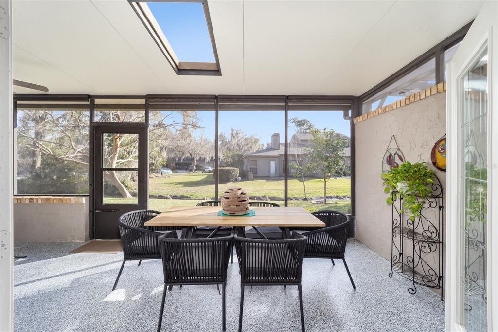 1731 Southeast Clatter Bridge Road Ocala, FL 34471 - Photo 37 of 52 a view of a dining room with furniture window and outside view