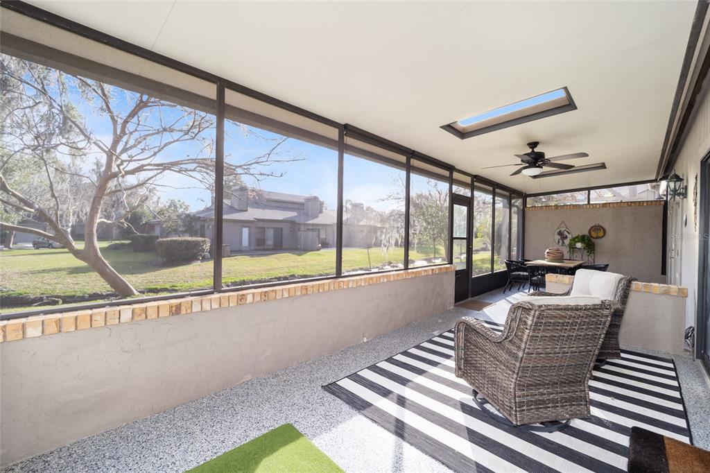 1731 Southeast Clatter Bridge Road Ocala, FL 34471 - Photo 41 of 52 a view of an empty room with wooden floor and a table