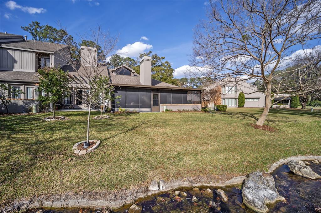 1731 Southeast Clatter Bridge Road Ocala, FL 34471 - Photo 44 of 52 a view of a house with a yard