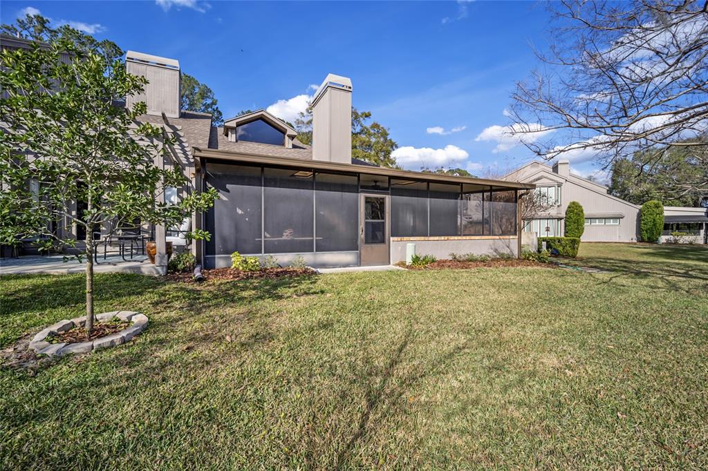 1731 Southeast Clatter Bridge Road Ocala, FL 34471 - Photo 45 of 52 a view of a house with a yard