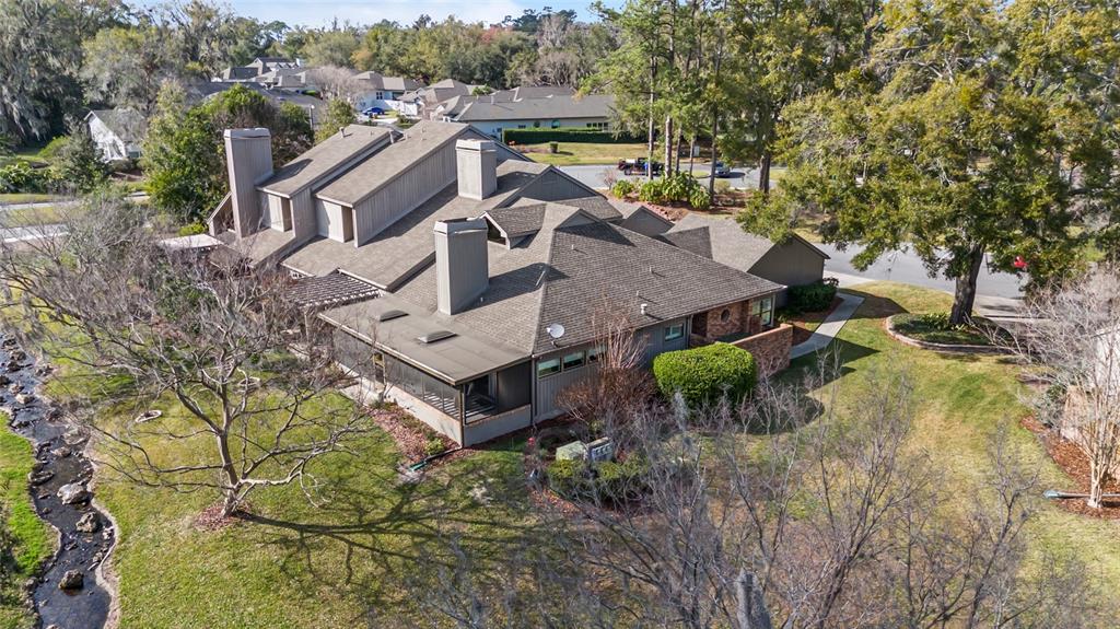 1731 Southeast Clatter Bridge Road Ocala, FL 34471 - Photo 48 of 52 an aerial view of house with yard and mountain view in back