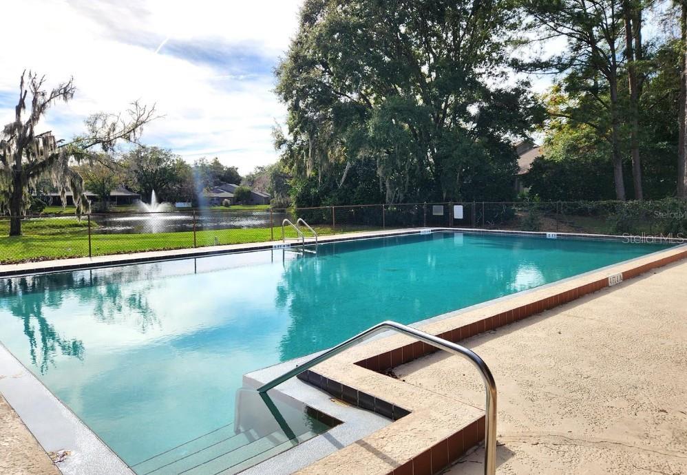 1731 Southeast Clatter Bridge Road Ocala, FL 34471 - Photo 52 of 52 a view of a swimming pool with a lake view