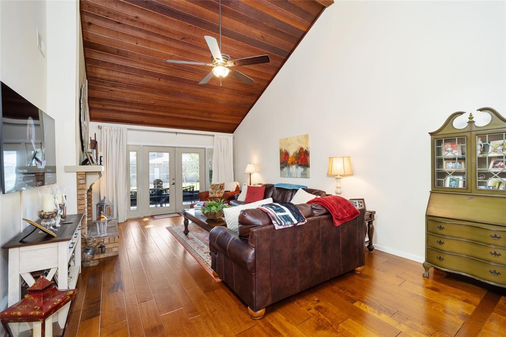 1731 Southeast Clatter Bridge Road Ocala, FL 34471 - Photo 7 of 52 a living room with furniture and a wooden floor
