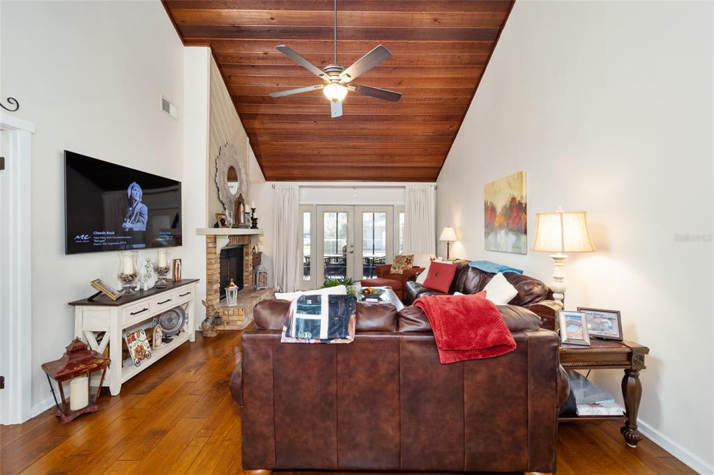 1731 Southeast Clatter Bridge Road Ocala, FL 34471 - Photo 8 of 52 a living room with furniture and a flat screen tv