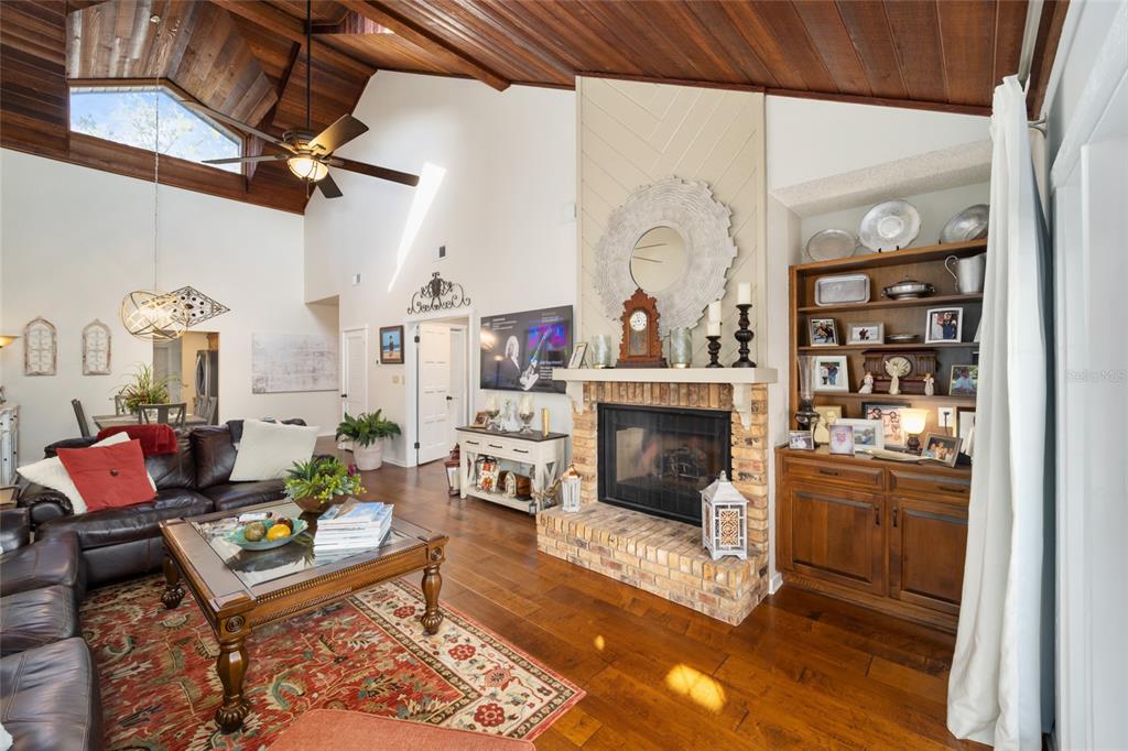 1731 Southeast Clatter Bridge Road Ocala, FL 34471 - Photo 10 of 52 a living room with furniture fireplace and rug