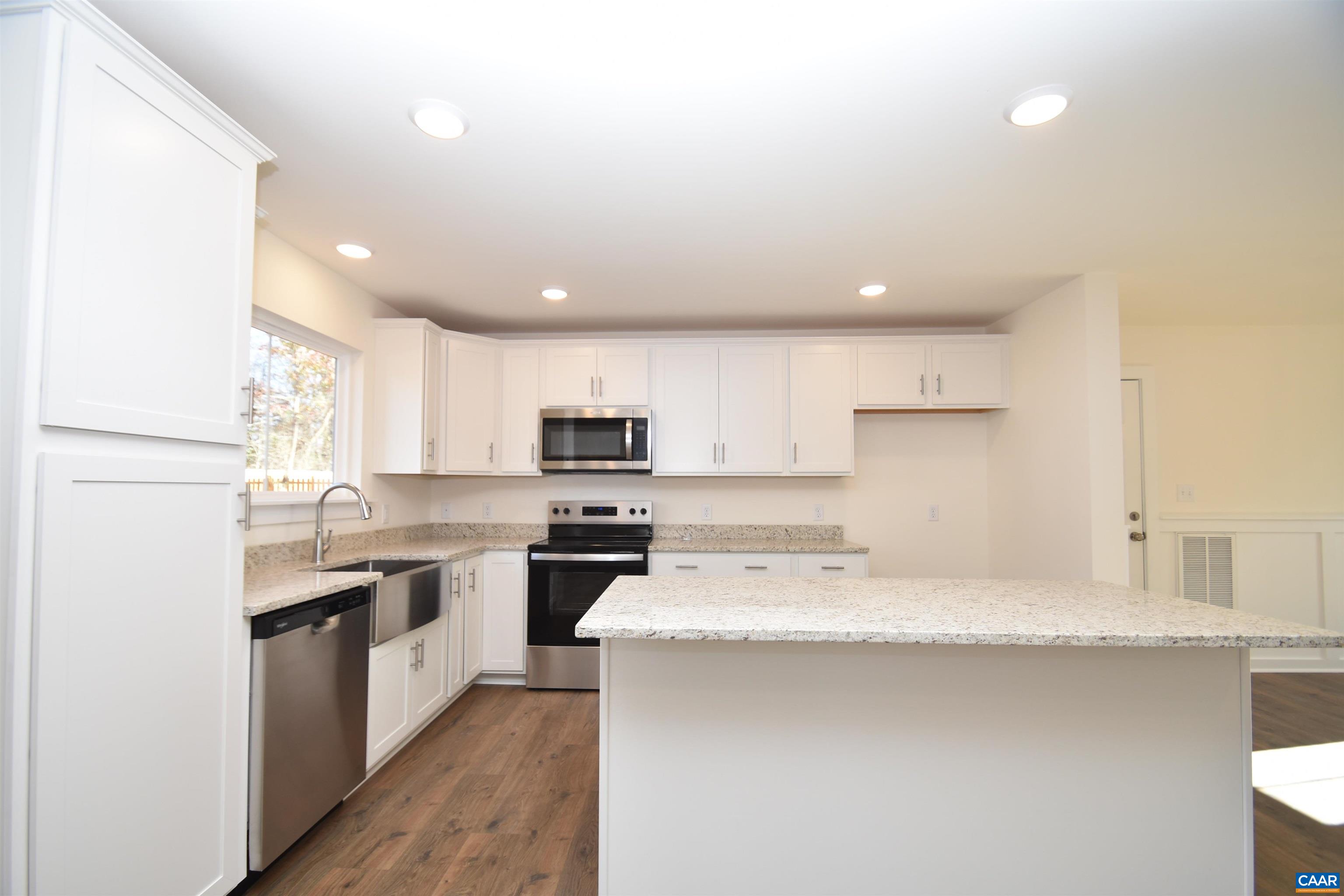 Lot4 Kidds Dairy Road, Unit KD4 Scottsville, VA 24590 - Photo 2 of 26 a kitchen with stainless steel appliances kitchen island granite countertop a sink a stove top oven a counter space and cabinets