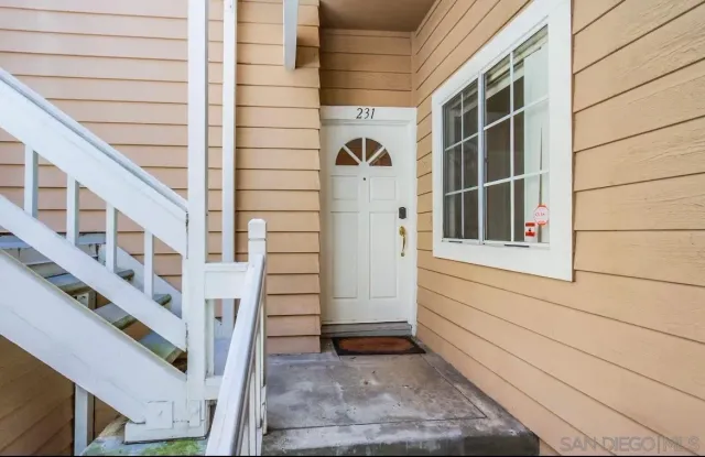 a view of a house with a street
