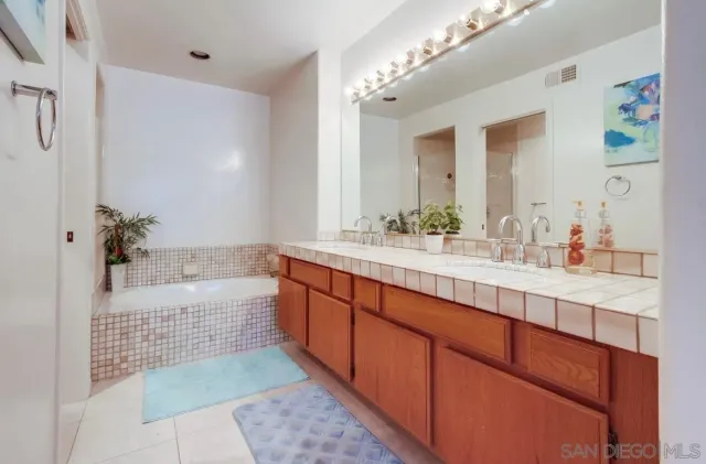 a bedroom with a large bed and a large window