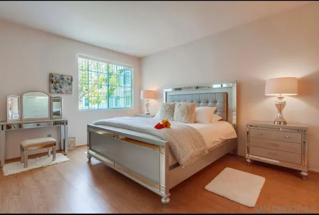 a bedroom with a bed and a table