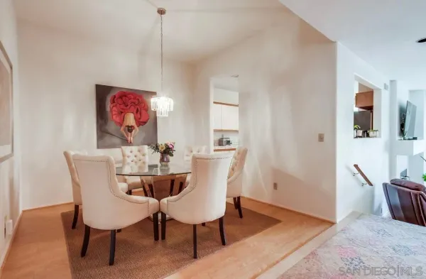 a dining room with furniture and window