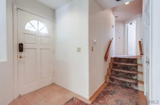 a dining room with furniture and a window