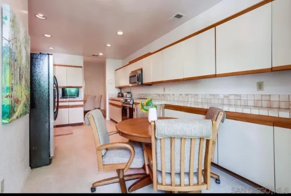 a view of a dining room with furniture window and outside view