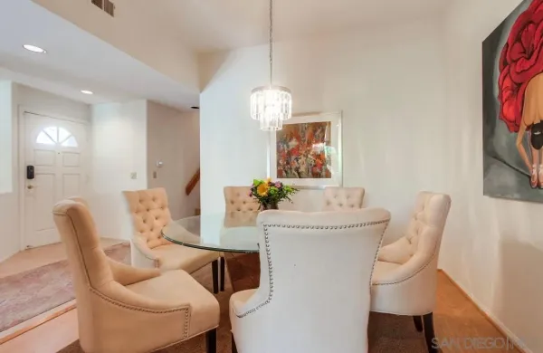 a dining room with furniture and window