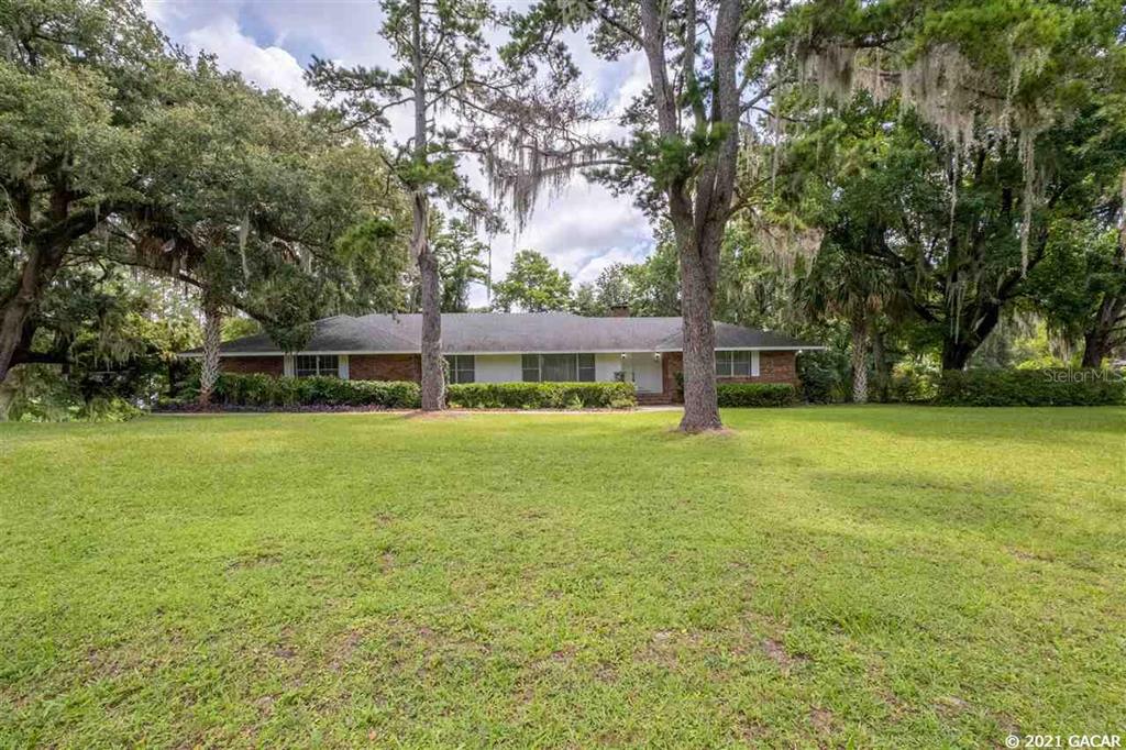 7001 Southwest 30th Way Gainesville, FL 32608 - Photo 1 of 1 a view of a house with a yard