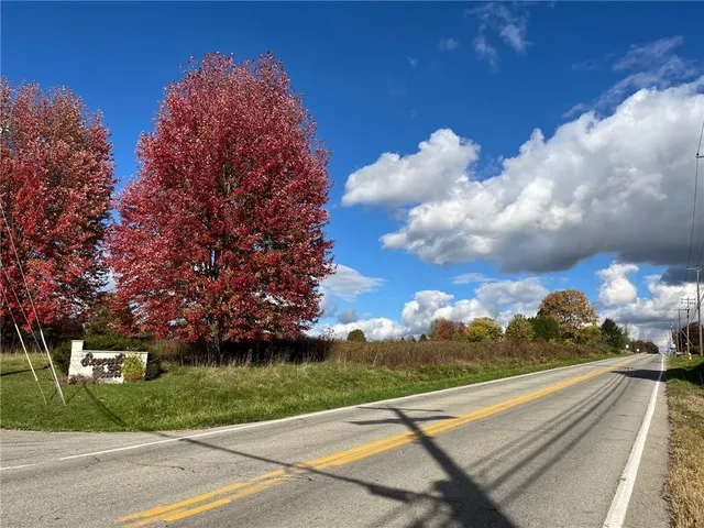 a view of a street with a building in the background