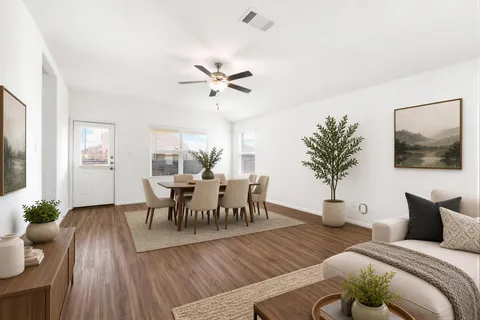 a view of a dining room with furniture and wooden floor