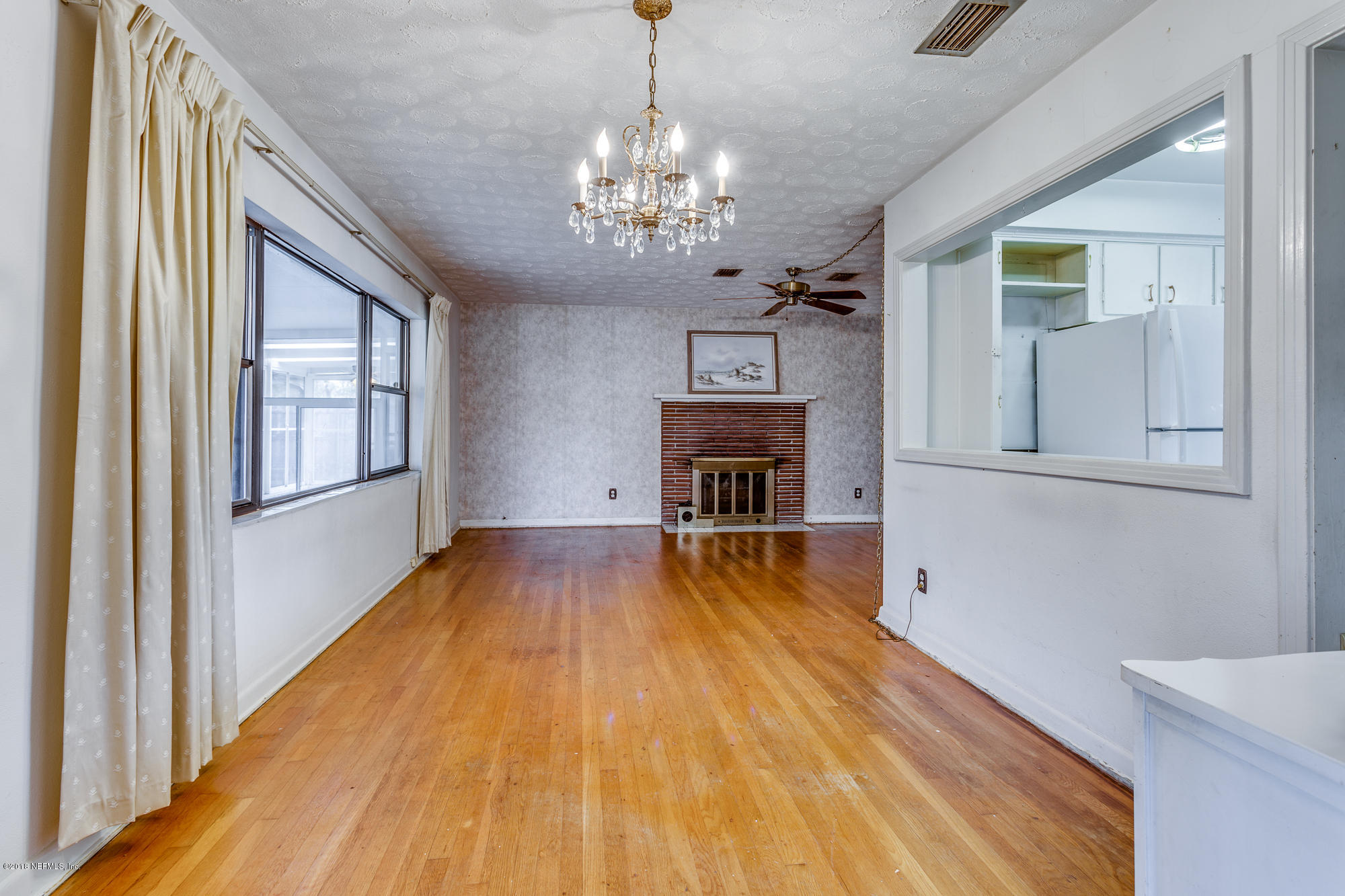 6335 Temple Road Jacksonville, FL 32217 - Photo 11 of 46 a view of a livingroom with wooden floor and staircase