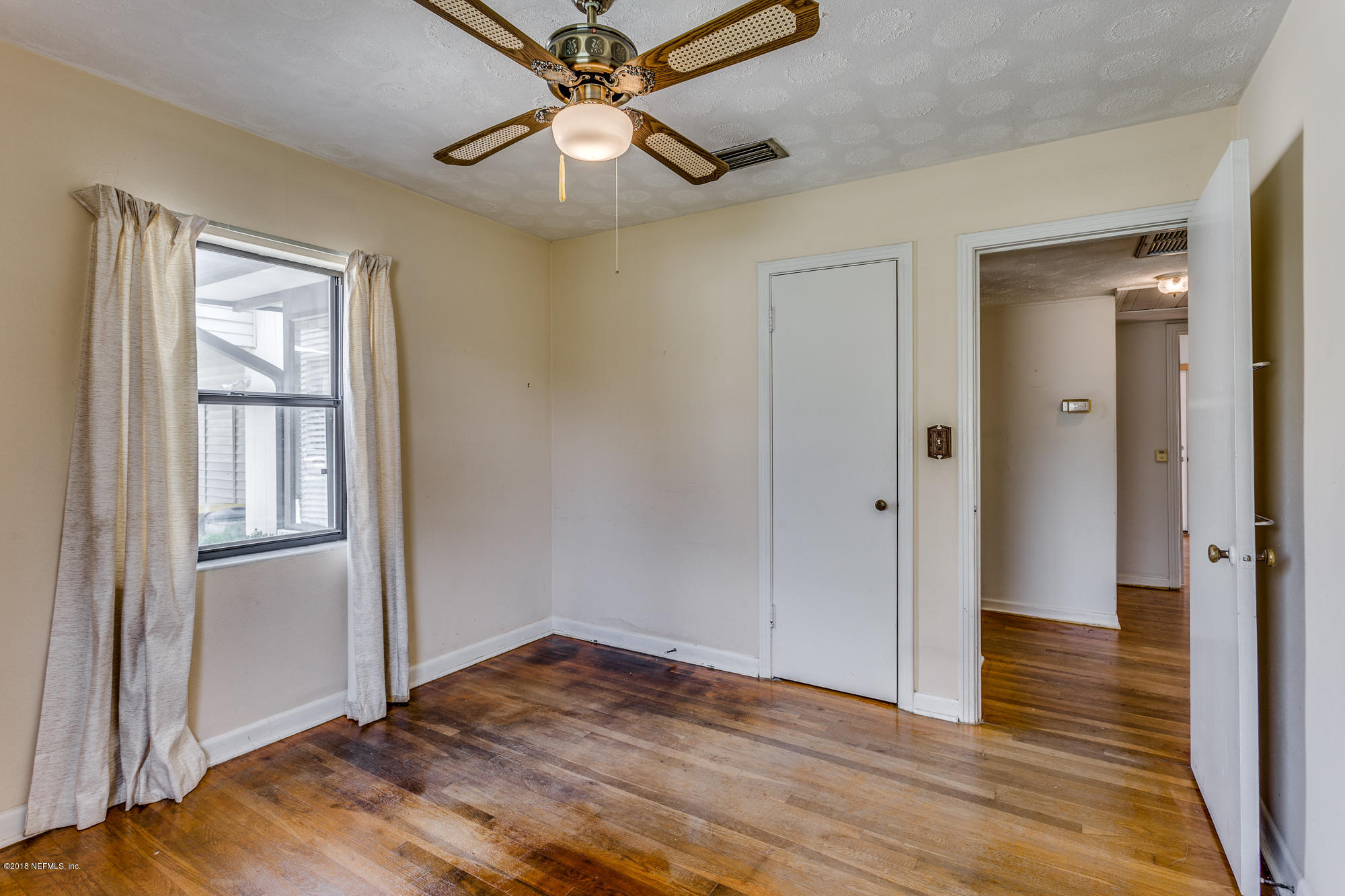6335 Temple Road Jacksonville, FL 32217 - Photo 23 of 46 wooden floor in an empty room with a window