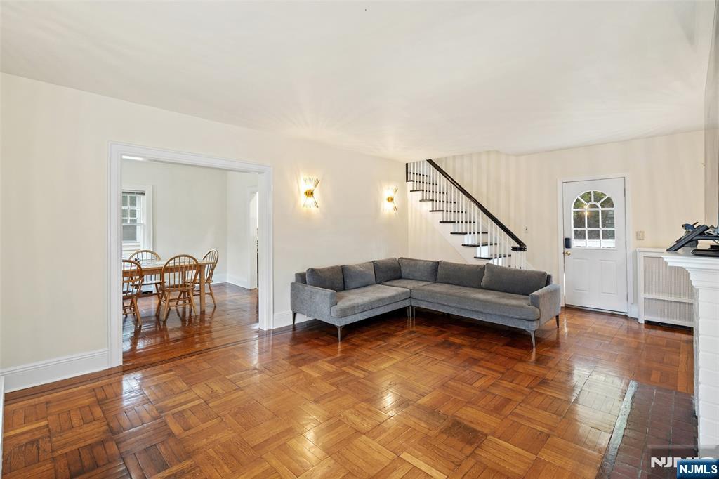 401 Conrad Road Englewood, NJ 07631 - Photo 12 of 42 a living room with furniture and a wooden floor