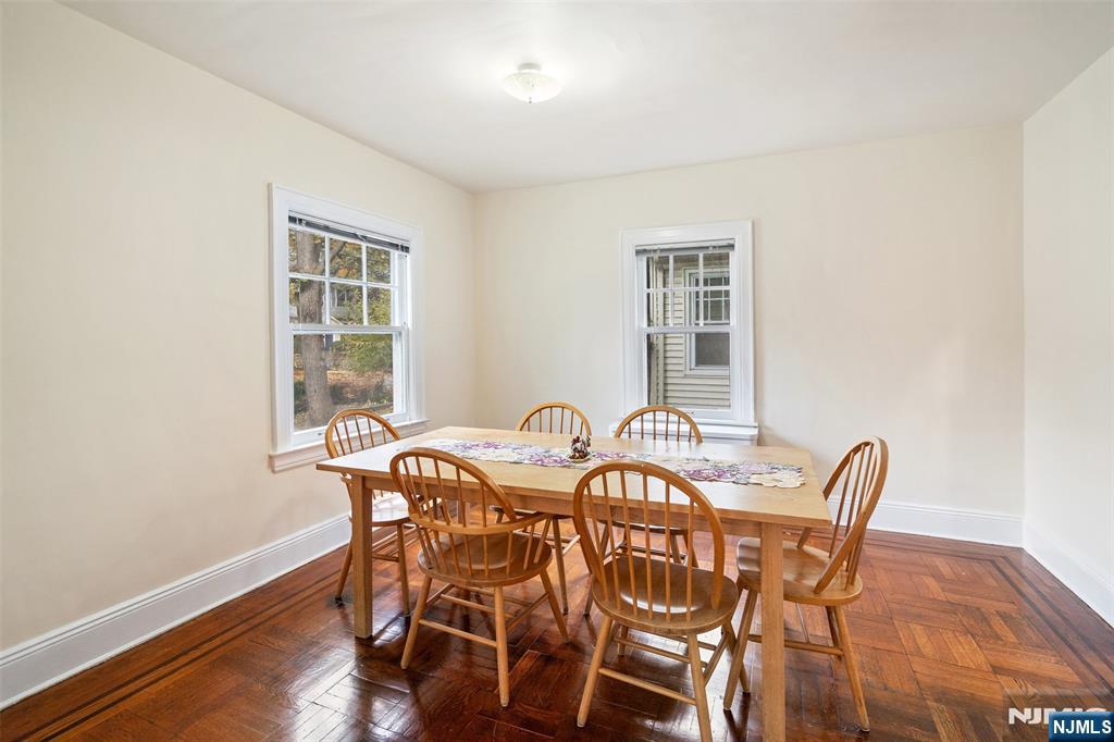 401 Conrad Road Englewood, NJ 07631 - Photo 13 of 42 a view of a dining room with furniture and wooden floor
