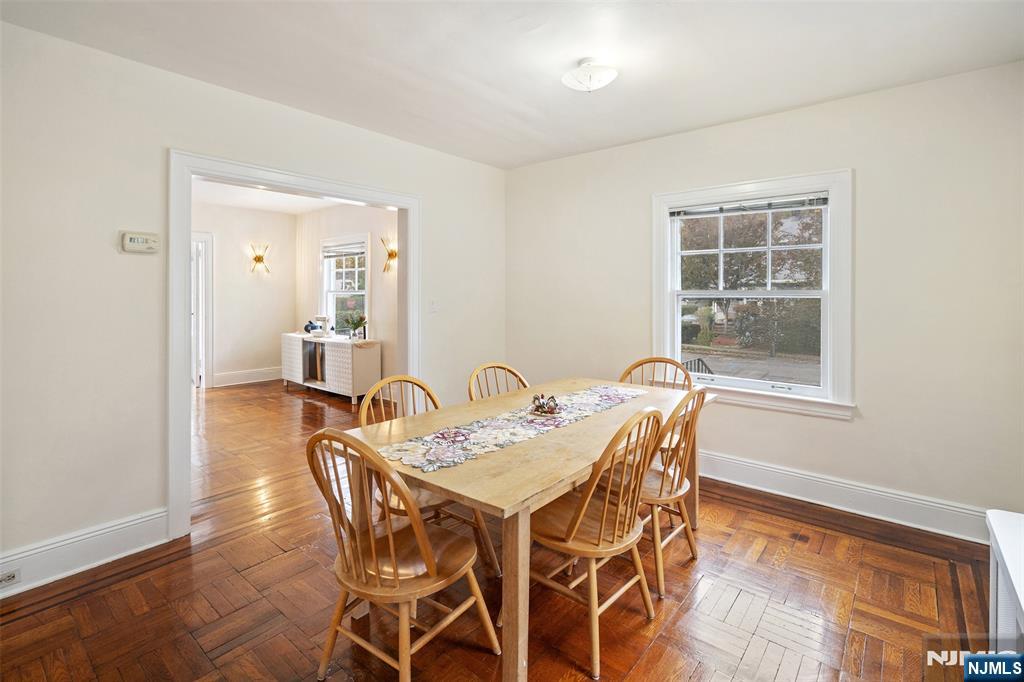 401 Conrad Road Englewood, NJ 07631 - Photo 14 of 42 a view of a dining room with furniture and wooden floor